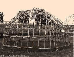 Rectangular House With A Barrel Shaped Roof Covered In Bark