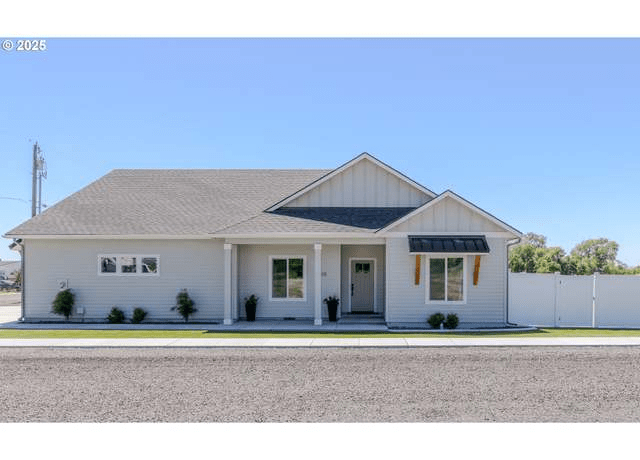 Houses In The Countryside Of Stanfield White House Blue Roof – A Rustic Retreat Worth Exploring