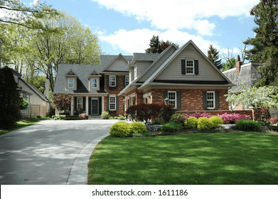 Red Brick House With Black Roof And Dark Green Shutters: Timeless Elegance Meets Modern Style