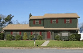 Sage Green House With Dark Red Trim and Medium Brown Roof: A Timeless Color Combination